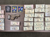 West Hartford police confiscated a loaded pistol and more than $100,000 cash on an accused drug dealer they booked on Wednesday.