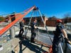 The Southington Fire Department this week spent time training for a contingency its members hope isn't required, a person stuck at the bottom of a sewer plant tank. Here, rescuers stand above the ledge looking down below at the deep tank.