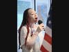 Ayesha Jackson of West Hartford sings 'God Bless America' at Thursday's event at Avery Heights in Hartford to honor veteran residents there and the U.S. Marine Corp.