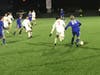 Hall of West Hartford and Greenwich High battle it out in the first half of their state LL championship game in Hartford Saturday night.
