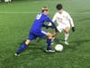 Hall of West Hartford and Greenwich High battle it out in the first half of their state LL championship game in Hartford Saturday night.