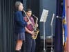 Quinn Carson, Grade 5, and Gabriel Jados, Grade 6, play 'Taps' to honor veterans