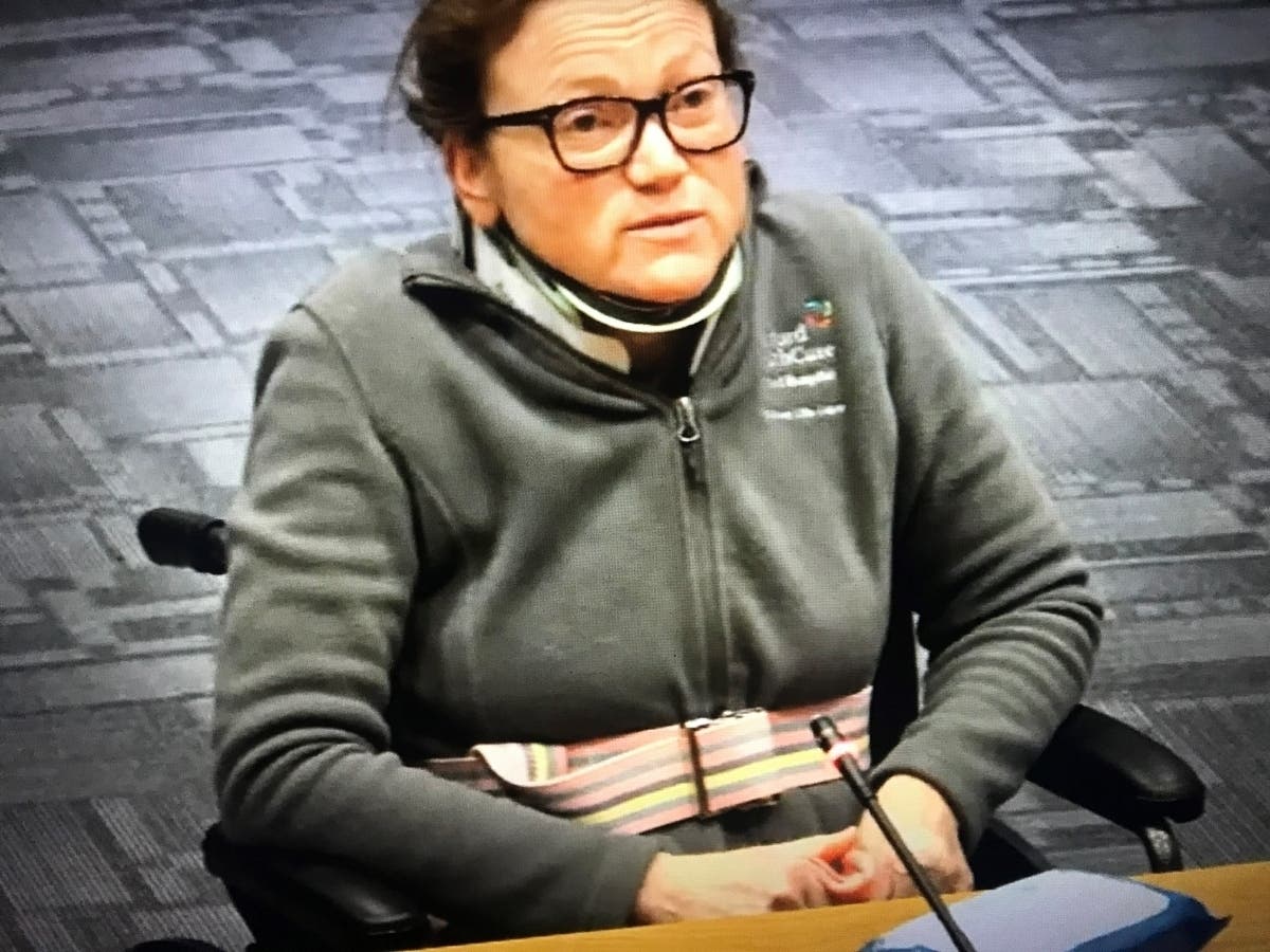 In this video still from Tuesday's West Hartford Town Council meeting, local resident Kelly Hamman-Book testifies before the council about her ordeal after being struck by a vehicle in a crosswalk on Dec. 17 in town.