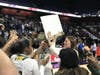 Hamden High School head girls basketball coach Amanda Forcucci celebrates her team's state title Saturday.