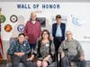 Residents of The Orchards at Southington gathered in front of the 'Wall of Honor.' Pictured
are: Wayne Armstrong and Robert Chevrette, top, and from the bottom left are:
George Proffit, Sherri Vogt, of Hartford HealthCare, and Peter Hilborn.