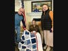 Middlewoods of Farmington resident, Leomenia 'Lee Pappas,' center, shows off her newly awarded Quilt of Valor in a photo with her daughter, Mercedes Suchocki, right, and son-in-law, John Suchocki, left.