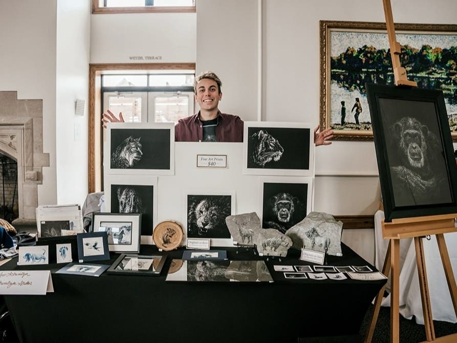 West Hartford resident Max Schweitzer shows off some of his creations behind his award-winning 'Clark Tank' business project at his college, Clark University in Worcester, Mass.