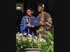 University of Saint Joseph President Rhona Free, left, presents Kingsley Ennin with his pharmacy diploma Saturday.