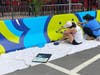 The outdoor concrete traffic barriers at two West Hartford dining/shopping destinations will be getting some artistic attention at a special artist event Saturday.