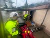 Colleagues of Southington Fire Department Lt. Daniel Cohen gain entry into a flooded home in Vermont as a team of specially trained Connecticut responders are aiding that state's rescue and recovery from flooding up north. Comen took this picture.