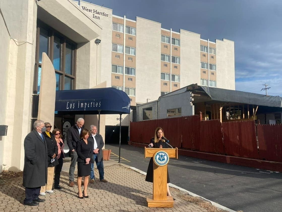 Town and state officials gathered at 900 Farmington Ave. in West Hartford in January to announce a nealry $1 million state grant to help develop the West Hartford Inn into affordable housing. The town council has OK'd tax breaks for the site as well.