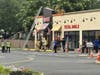 Vernon Volunteer Fire Department firefighters swarm a local Dunkin' Donuts doughnut/coffee shop Friday morning in response to an HVAC fire atop the building.