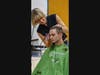 USJ student Quinn Perkins of Norwich gets his head shaved for pediatric cancer Sunday.