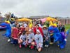 Members of the USJ women's soccer team weren't too tired from practice Monday to enjoy a little community Halloween spirit at the school's 'Truck or Treat' celebration with local children.