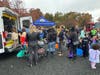 Several area children donned costumes and enjoyed visits on several trucks and vehicles, including this ambulance, as part of USJ's Halloween 'Truck and Treat' Halloween celebration with the community.