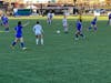 Suffield High School, in blue, scrambles for the ball with Bacon Academy Saturday in the CIAC Class M state title game for girls soccer.