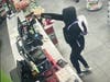 This surveillance footage courtesy of local police shows the moment when an armed suspect pointed a gun at a Berlin gas station clerk and demanded money.