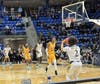 The action is fast and furious at M & T Bank Arena at Quinnipiac University. Here, the Bobcats hoist up a three-point attempt en route to their comeback win over Iona last Sunday.