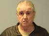 Robert John Washam, 69, of East Hartford, was charged in connection with a wrong-way crash in which the vehicle he was driving collided with a state police cruiser Sunday morning.