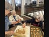 Farmington Station residents, Juney Cushman, Audrey Kasakowski, and Sandy Manning work on their homemade dog treats for a Bloomfield-based canine rescue organization.