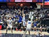 The action was intense in Saturday's CIAC Division III boys basketball title game at the Mohegan Sun Arena in Uncasville. Here, Lewis Mills turns on the defense against Bunnell.