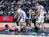 The action was intense in Saturday's CIAC Division III boys basketball title game at the Mohegan Sun Arena in Uncasville. Here, Lewis Mills players hit the deck after fighting over a loose ball with Bunnell.