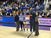 Bunnell senior Jordan Ricketts is honored with the game's MPV award. To his right is Bulldog head coach Donnie Powell. Ricketts had 15 points and 6 rebounds.