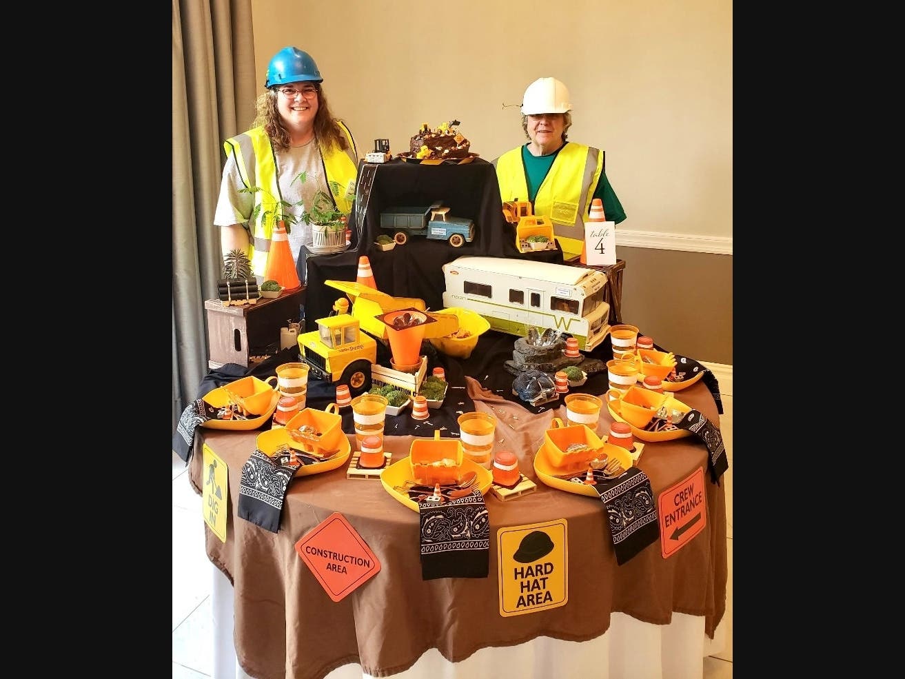 Celebrating their first-place win at Tablescapes 2024 in Avon are Renee Holder and her mother, Rose Bennett, who wore hard hats to coordinate with their Table 'If You Can Dream It, You Can Build It.'