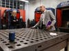 USJ President Rhona Free, left, gets a tour of the MakerspaceCT facility in Hartford recently. The West Hartford-based university and the Hartford nonprofit education/training center recently inked a partnership deal to work together.