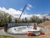 Workers recently built the walls for a massive water tank replacement project in Avon.