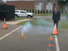 U.S. Sen. Richard Blumenthal, D-Conn., watches as a sparkler erupts after hit lit it during a demonstration on fireworks safety Wednesday at the West Hartford Fire Department.