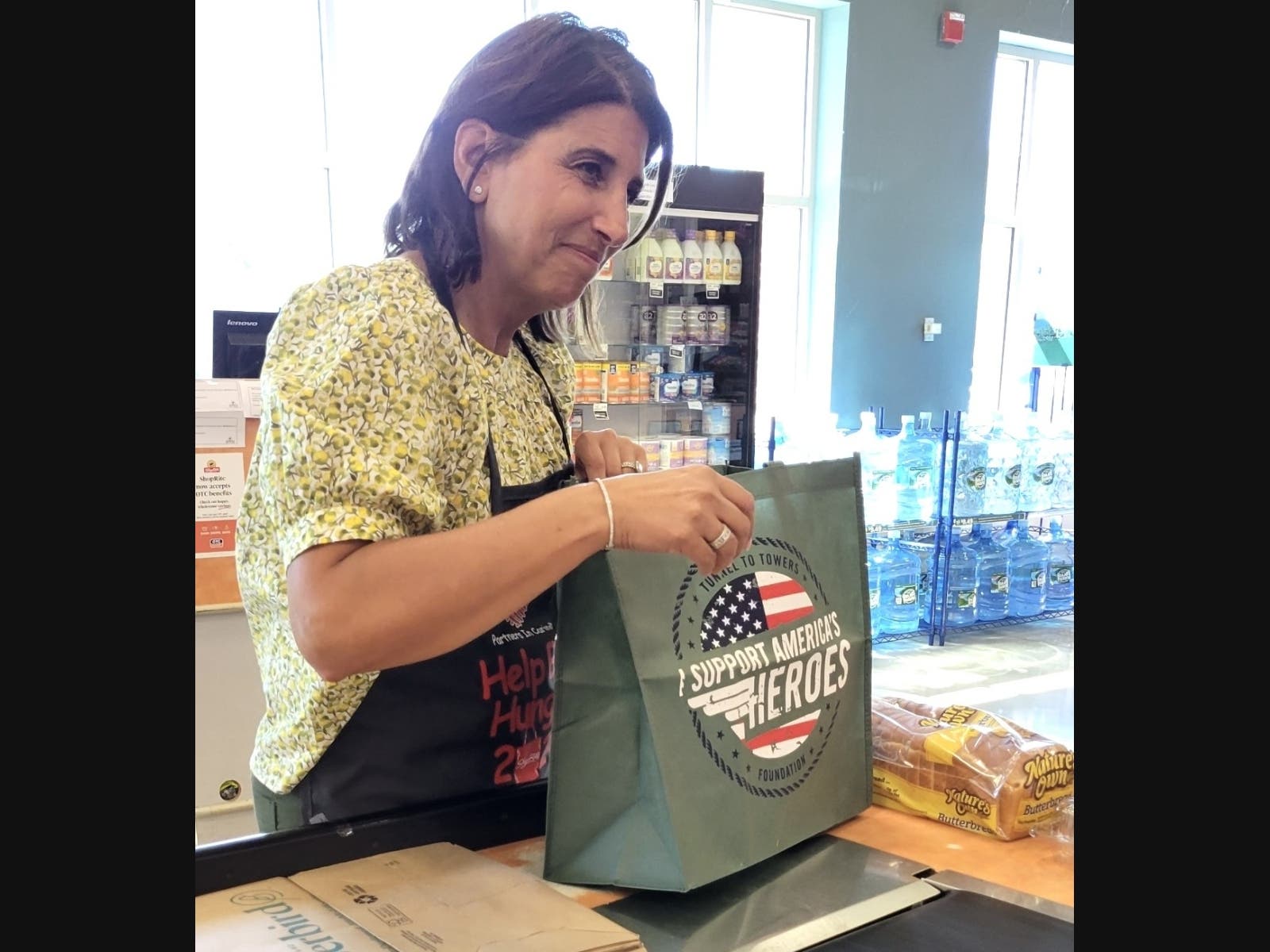 State Sen. Lisa Seminara, R-Avon, bags groceries at a fundraiser to battle food insecurity at the Canton ShopRite on Tuesday.