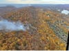 This image, posted from a Maine Forest Rangers helicopter last week, show the distance between the massive forest fire on Lamentation Mountain in Berlin and the nearest residential area. So far, no evacuations have been ordered.
