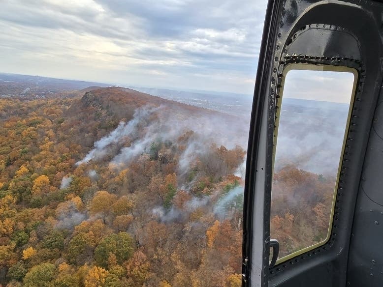 Lamentation Mountain in Berlin as seen from the air recently from a Maine Forest Rangers helicopter aiding the effort to battle the blaze, which has burned since Oct. 21.