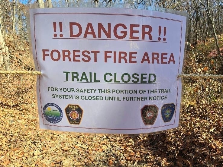 Since Oct. 21, these signs have been all over the trail network near Lamentation Mountain in Berlin, which has been ravaged by fire. Slowly, however, trails are opening up and firefighting operations are scaling down, the Berlin FD said Thursday.