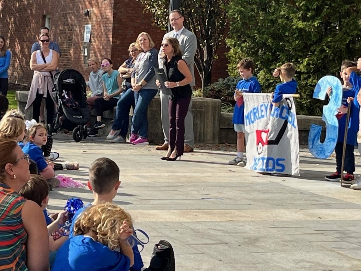 West Hartford Mayor Shari Cantor greets pupils from Morley Elementary School in West Hartford Thursday morning after they delivered 60 wagons full of non-perishable food for the local food pantry.