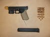 Southington police found this gun in the bushes that was discarded by the suspect after he crashed his car on a light pole guide wire early Thursday morning.