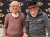 Farmington Station residents Reena Kondo and David Goldberg strut their stuff during a recent 'Red Carpet' celebration at the assisted living facility prior to awards season.