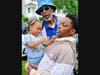 The late Malachi James, right, holds his young niece recently while his father, Thomas 'Christopher' James, looks on.