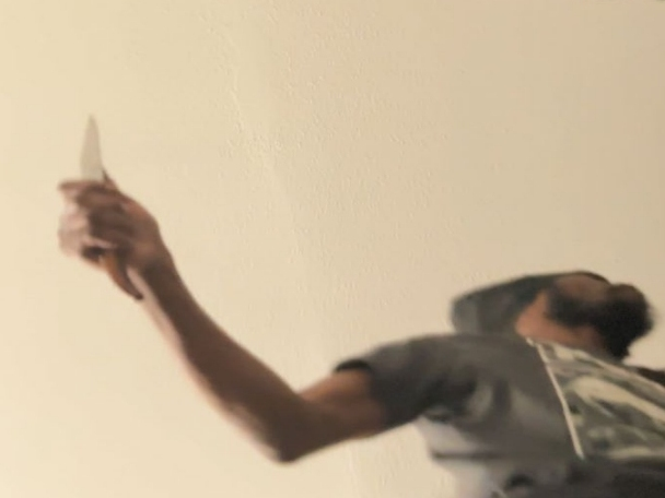 This video still of a Hartford police officer's body camera showing a 53-year-old Hartford man brandishing a knife just before an officer shot and killed him Feb. 19. The state is investigating the fatal, officer-involved shooting.