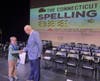 Newington fifth-grader Samuel Smith won the Connecticut State Spelling Bee at the Noah Webster. Here, he is congratulated by Jeffrey Mainville, executive director of the Noah Webster House & West Hartford Historical Society.