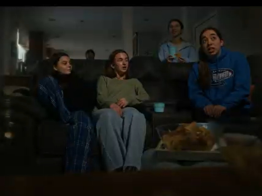 Teens gather in a darkened room to watch the Super Bowl, as depicted in a newly released Southington High School video public service announcement on teen sports gambling.