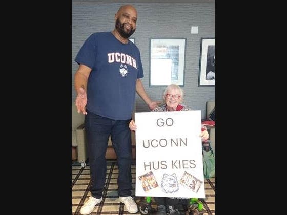 Riverbend resident, Joan Gross, and ex-University of Connecticut basketball player Jeff Carr.