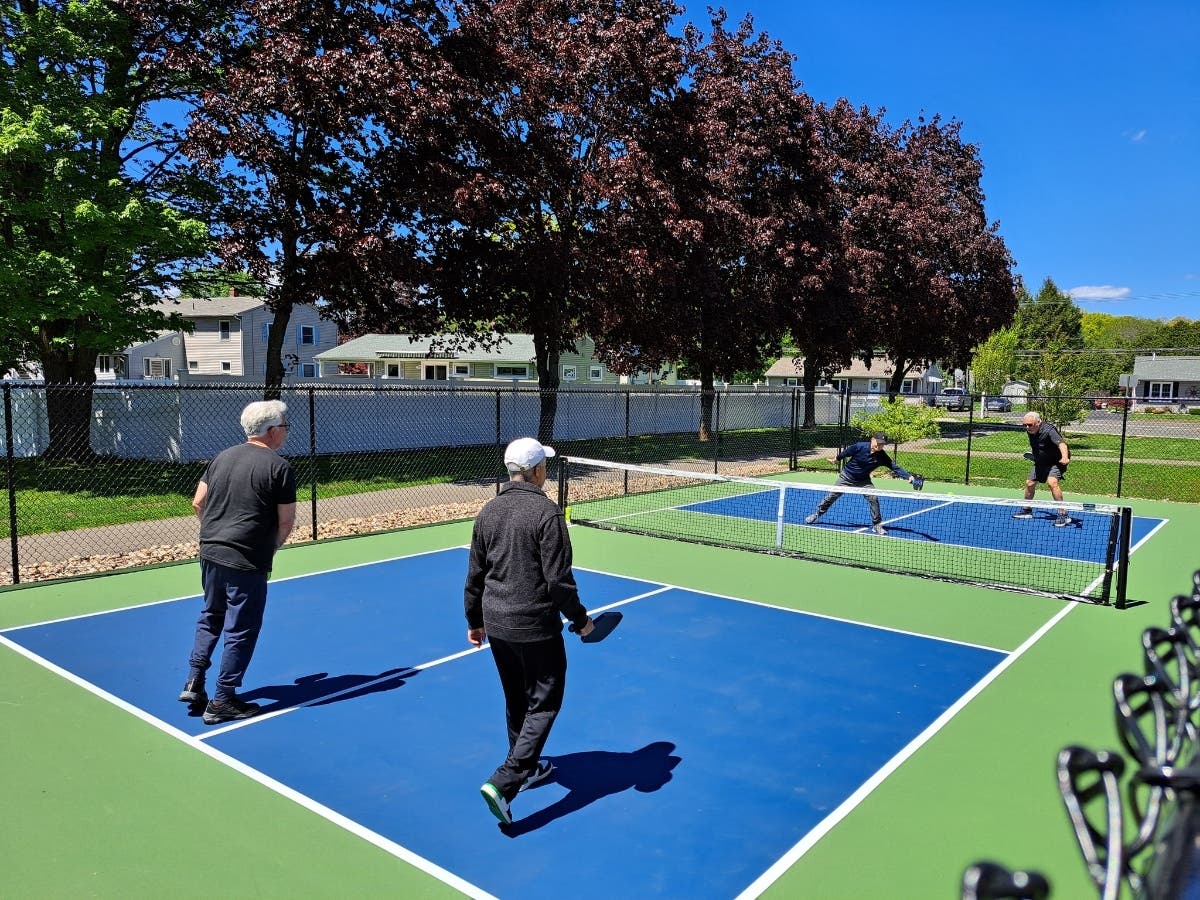 The Southington Calendar House Senior Center officially opened a new outdoor pickleball court with a ribbon-cutting ceremony, followed by a demonstration by local players, above.