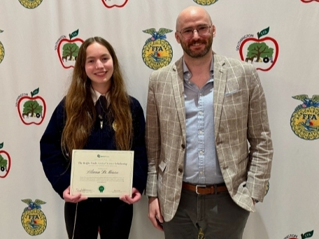 Bright Feeds, a Berlin-based agricultural feed manufacturer, recently awarded its Bright Feeds Animal Science Scholarship to Liliana DiMauro, a 2026 SHS graduate, left. At right is Dan Neubelt, head of finance for Bright Feeds.  