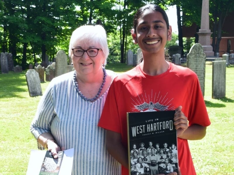 New tours of the Old Center Burying Ground, now known as Center Cemetery, were created by West Hartford Town Historian Mary Donohue, left, and Andrew Rana, right, a Hall High School student and Eagle Scout candidate.