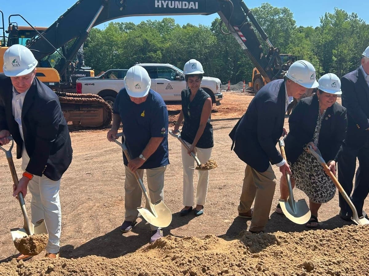Town and state officials on Friday plunged shiny shovels into the earth to break ground on The Kensington, a senior housing development at 143 Percival Ave.