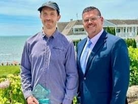Award winner Matt Noonan, left, with Riverbend Maintenance Director Sebastian Italia.