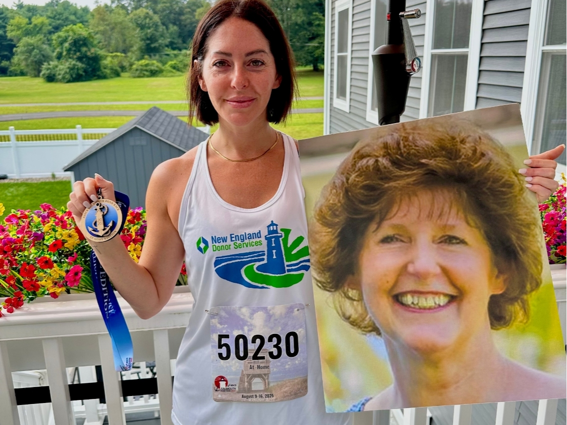 Avon resident Heather Harris, after running the Falmouth Road Race virtually in 2025, poses with a photo of her mother. She's running the virtual race again this weekend in her honor.