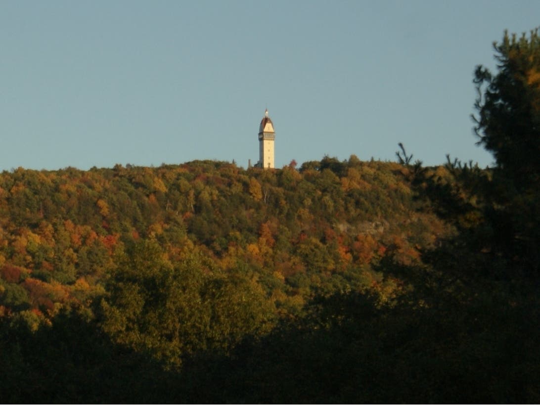 Simsbury's iconic Heublein Tower at Talcott Mountain State Park, as seen across the border in Avon. This weekend, the annual 'Hike to the Mic' music festival will take place there Saturday and Sunday, Aug. 29-30.